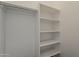 An empty walk-in closet with plenty of room for storage at 578 E Las Puertas Ln, Queen Creek, AZ 85140