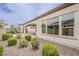Home exterior featuring desert landscaping, walkway, archway, and neutral paint at 578 E Las Puertas Ln, Queen Creek, AZ 85140