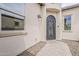 Exterior shows the walkway and wrought iron front door at 578 E Las Puertas Ln, Queen Creek, AZ 85140