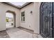 Front entrance with stone pavers and wrought iron door at 578 E Las Puertas Ln, Queen Creek, AZ 85140