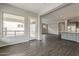 Spacious and inviting living area featuring modern finishes, wood flooring, and plenty of natural light at 578 E Las Puertas Ln, Queen Creek, AZ 85140