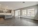 Bright living room boasts large windows and views into the backyard at 578 E Las Puertas Ln, Queen Creek, AZ 85140