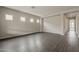 This living room has wood floors, neutral walls, and several small windows at 578 E Las Puertas Ln, Queen Creek, AZ 85140