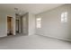 Spacious main bedroom with neutral paint, carpet flooring, and natural light from two windows at 578 E Las Puertas Ln, Queen Creek, AZ 85140