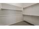 Walk-in closet with metal clothing rods and neutral carpet flooring at 578 E Las Puertas Ln, Queen Creek, AZ 85140