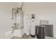 This utility room features a water heater and a water conditioning system at 578 E Las Puertas Ln, Queen Creek, AZ 85140