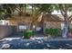 A charming complex with mature trees, brick accents, and a nicely paved entryway to a secure mail delivery center at 2228 N 52Nd St # 227, Phoenix, AZ 85008