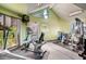 Community fitness center with modern exercise equipment, natural light, and green walls for a revitalizing workout at 2228 N 52Nd St # 227, Phoenix, AZ 85008