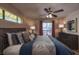 Relax in this primary bedroom, with a large window, ceiling fan, and en-suite bath at 2228 N 52Nd St # 227, Phoenix, AZ 85008