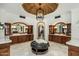 Elegant bathroom with dual vanities, unique brick dome ceiling, and large marble tile flooring at 7533 N 70Th St, Paradise Valley, AZ 85253