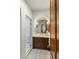 Bathroom with marble shower, dark wood cabinets, and views of the outdoors at 7533 N 70Th St, Paradise Valley, AZ 85253