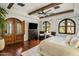Bedroom featuring a ceiling fan, recessed lighting, a chest of drawers with a TV, and two windows at 7533 N 70Th St, Paradise Valley, AZ 85253