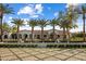 Elegant home featuring a meticulously designed lawn, fountains, and palm tree lined entrance at 7533 N 70Th St, Paradise Valley, AZ 85253