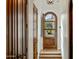 Inviting foyer showcasing a wood-framed glass door and tiled flooring at 7533 N 70Th St, Paradise Valley, AZ 85253