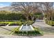 An immaculate landscaped front yard featuring a rectangular fountain and lush greenery at 7533 N 70Th St, Paradise Valley, AZ 85253
