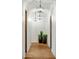 Bright hallway with decorative pendant lights and tiled flooring at 7533 N 70Th St, Paradise Valley, AZ 85253