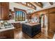 Gourmet kitchen featuring custom cabinetry, a large island, and stainless steel appliances at 7533 N 70Th St, Paradise Valley, AZ 85253