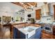 Modern open kitchen with a large island, farmhouse sink, and high-end stainless steel appliances at 7533 N 70Th St, Paradise Valley, AZ 85253