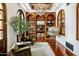 Cozy living room with built-in wooden shelving, a chandelier and a painting on display at 7533 N 70Th St, Paradise Valley, AZ 85253