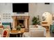 Cozy living room showcasing a stone fireplace, decorative accents, and comfortable seating at 7533 N 70Th St, Paradise Valley, AZ 85253
