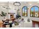Bright living room featuring high ceilings, fireplace, piano, and views of the pool and landscape at 7533 N 70Th St, Paradise Valley, AZ 85253