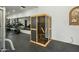 Home gym featuring an infrared sauna with a wood frame and a glass door for a relaxing experience at 7533 N 70Th St, Paradise Valley, AZ 85253