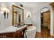 Vanity area with a large mirror, makeup station, and decorative lighting at 7533 N 70Th St, Paradise Valley, AZ 85253