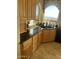 Kitchen features granite counters, wood cabinets and arched window at 11519 E Blue Wash Rd, Cave Creek, AZ 85331