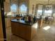 Spacious kitchen with island, granite counters, and a breakfast nook at 11519 E Blue Wash Rd, Cave Creek, AZ 85331