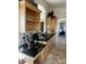 Well-equipped kitchen with built-in desk and granite countertops at 11519 E Blue Wash Rd, Cave Creek, AZ 85331