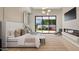 Bright bedroom with fireplace, large windows, and backyard access at 6554 N 40Th Pl, Paradise Valley, AZ 85253