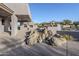 Relaxing backyard patio with a water feature and built-in grill at 41327 N 106Th St, Scottsdale, AZ 85262