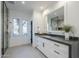 Modern bathroom with marble finishes, double sinks, and a large shower at 41327 N 106Th St, Scottsdale, AZ 85262