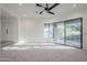 Spacious bedroom with a ceiling fan and access to a private patio at 41327 N 106Th St, Scottsdale, AZ 85262