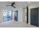 Bedroom with sliding glass doors and barn door at 41327 N 106Th St, Scottsdale, AZ 85262