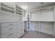 Large walk-in closet with custom shelving and drawers at 41327 N 106Th St, Scottsdale, AZ 85262