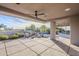 Large covered patio with ceiling fan and views of desert landscape at 41327 N 106Th St, Scottsdale, AZ 85262