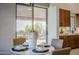 Bright dining area with a round table and view to backyard at 41327 N 106Th St, Scottsdale, AZ 85262