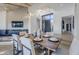 Modern dining room with wood table and contemporary light fixture at 41327 N 106Th St, Scottsdale, AZ 85262