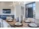 Bright dining room featuring a long wooden table and modern decor at 41327 N 106Th St, Scottsdale, AZ 85262