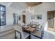 Open concept dining room with wood table and wine storage at 41327 N 106Th St, Scottsdale, AZ 85262