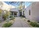 Inviting entryway with a courtyard and lush landscaping at 41327 N 106Th St, Scottsdale, AZ 85262