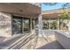 Back exterior view with sliding glass doors and stone accents at 41327 N 106Th St, Scottsdale, AZ 85262