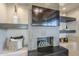 Modern fireplace with sleek gray tile surround and built-ins at 41327 N 106Th St, Scottsdale, AZ 85262