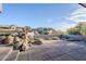 Spacious patio with a rock water feature and desert landscaping at 41327 N 106Th St, Scottsdale, AZ 85262