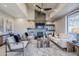 Spacious living room with a modern fireplace and large windows at 41327 N 106Th St, Scottsdale, AZ 85262