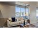 Light-filled living room with comfortable seating and large windows at 41327 N 106Th St, Scottsdale, AZ 85262