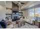 Living room with fireplace, comfy seating, and high ceilings at 41327 N 106Th St, Scottsdale, AZ 85262