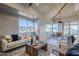 Bright living room features wooden floors and a cozy seating area at 41327 N 106Th St, Scottsdale, AZ 85262