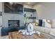 Living room with a modern fireplace and built-in shelves at 41327 N 106Th St, Scottsdale, AZ 85262